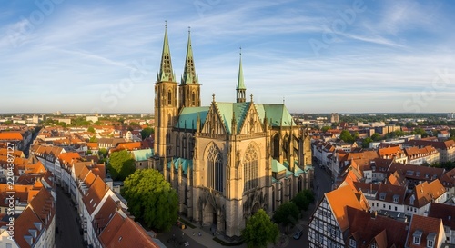 Aerial view of Paderborn Cathedral with historic city rooftops at sunset