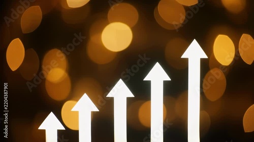 Abstract bokeh lights with rising white bar graphs indicating growth and success during festive celebrations