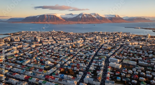 Aerial view of Reykjavik city with colorful rooftops and snowy mountains