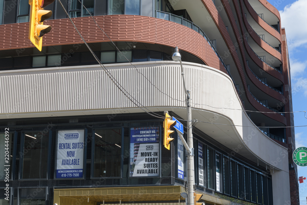 Obraz premium signage on the exterior of The Whitfield, a condominium complex, located at 180 Front St E, Toronto