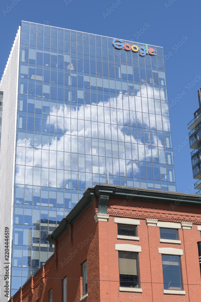 Obraz premium wordmark signage at the top of Google King East, a corporate office, located at 65 King St E, Toronto