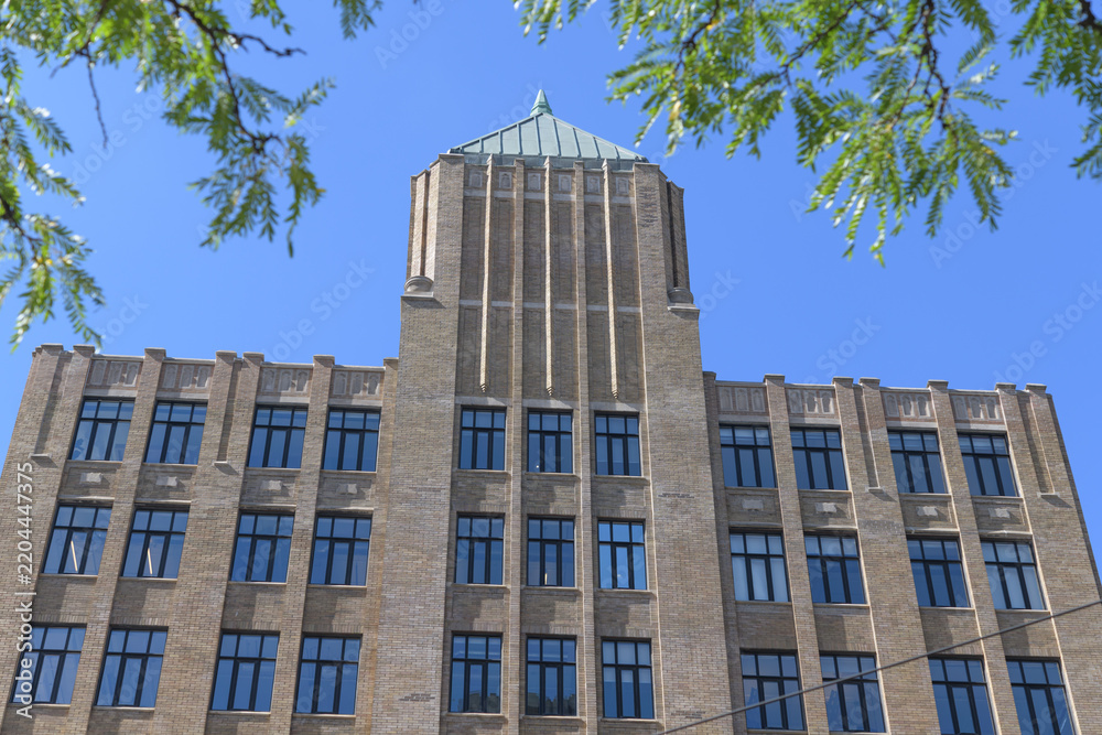 Obraz premium roofline and pyramidal tower at Tower Building designed by Benjamin Brown in Art Deco style located at 110 Spadina Av Garment District, Toronto