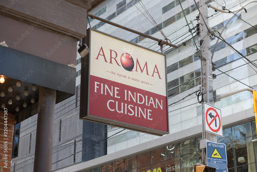 Obraz premium projecting sign outside Aroma Fine Indian Cuisine located at 287 King St W, Toronto