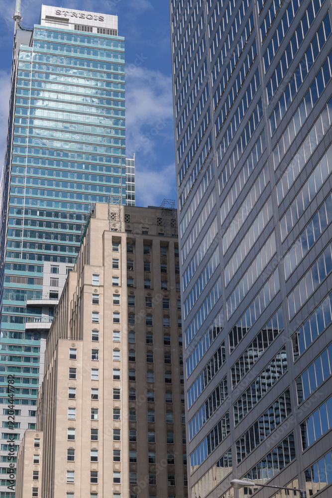 Obraz premium looking north on Bay St to (l to r) The St Regis, a hotel, Bank of Nova Scotia General Office, and Commerce Court West, Toronto