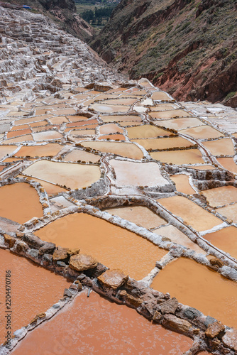 Maras, Peru - August 27, 2026: The Salt Mines of Maras is one of the largest salt extraction centers of prehispanic origin in Cusco Region, Urubamba, Peru.