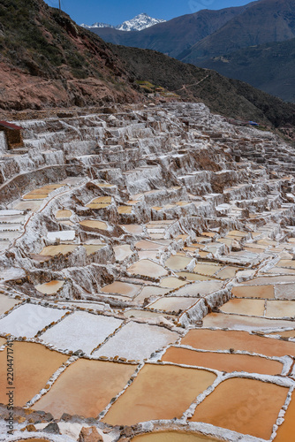 Maras, Peru - August 27, 2026: The Salt Mines of Maras is one of the largest salt extraction centers of prehispanic origin in Cusco Region, Urubamba, Peru.