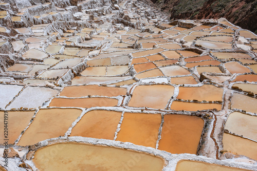 Maras, Peru - August 27, 2026: The Salt Mines of Maras is one of the largest salt extraction centers of prehispanic origin in Cusco Region, Urubamba, Peru.