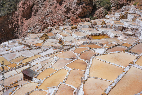 Maras, Peru - August 27, 2026: The Salt Mines of Maras is one of the largest salt extraction centers of prehispanic origin in Cusco Region, Urubamba, Peru.