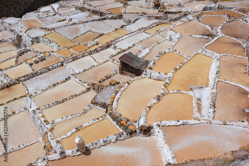 Maras, Peru - August 27, 2026: The Salt Mines of Maras is one of the largest salt extraction centers of prehispanic origin in Cusco Region, Urubamba, Peru.