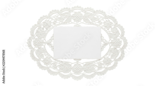 Blank rectangular paper note centered within an oval white crocheted lace doily frame on solid white background