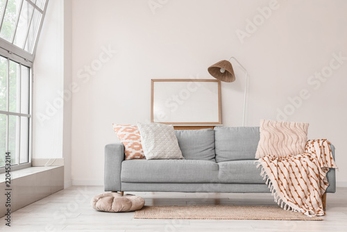 Interior design and home comfort, modern living room with grey sofa and empty...