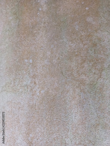 Cracked old concrete wall texture background with subtle green tint