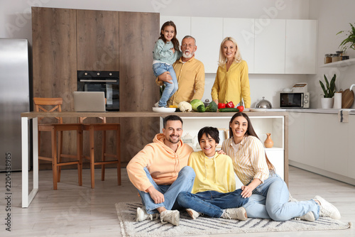 Big family with vegetables in kitchen
