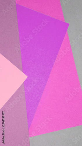 Vibrant geometric arrangement of overlapping colored paper sheets forming a t...