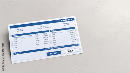 Paper paycheck stub with blue headers showing earnings, deductions and net pay on a light gray surface