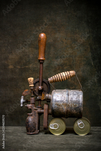 Konstfotografi Still life with an old blowtorch, a hand drill, and canned food