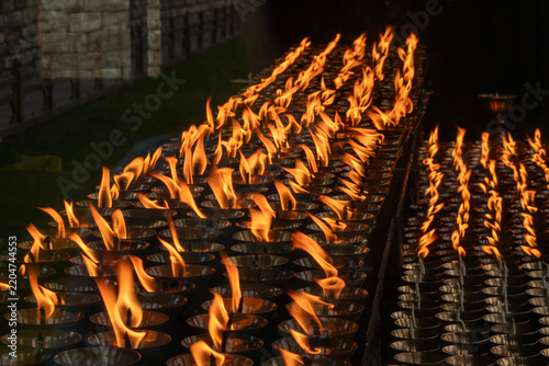 Thimphu Bhutan, view of flames of butter lamps at shrine