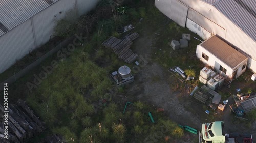 Aerial view of abandoned industrial backyard with truck
