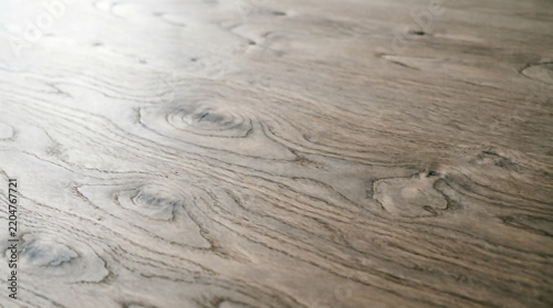 Light wood texture background showing natural grain patterns and soft knots for design use.