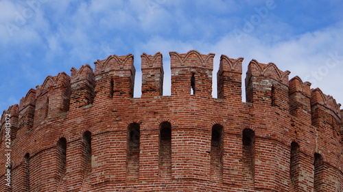 Battlements of an red brick fortress tower