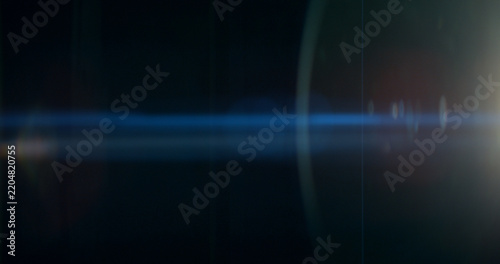 Blue anamorphic lens flare overlay featuring cinematic horizontal light streaks, soft optical reflections and subtle glow on a black background. Premium VFX element for compositing and film editing.