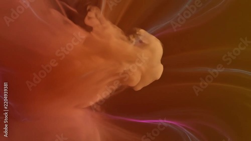 Dynamic abstract background featuring orange and brown smoke explosion with light rays.