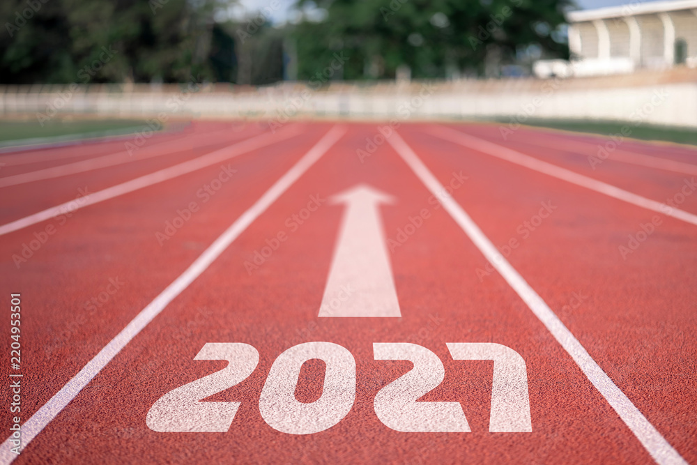 Obraz premium Empty running track with 2027 text and forward arrow on red rubber lane, athletic stadium new year concept