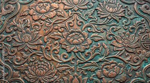 Antique Copper Relief Texture with Traditional Floral Pattern