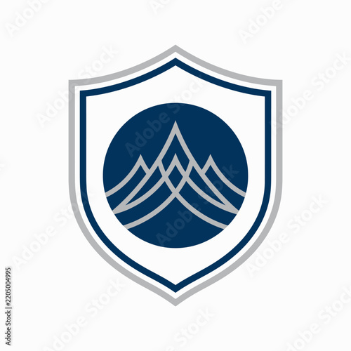 Abstract Mountain Peaks Inside A Shield Logo Graphic Design