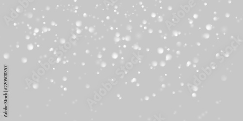 Soft white snow particles falling with blurred bokeh effect for winter, Christmas and snowfall overlays