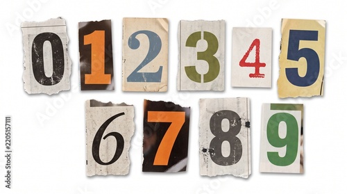 Set of ten numeric digits cut from newspapers and magazines arranged on a white background with individual numbers zero crafted torn paper