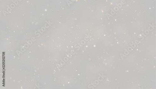 Scattered glowing particles appear suspended on a dark background. The lights vary in size and color from warm gold to cool white. This image is ideal for abstract or festive visual.