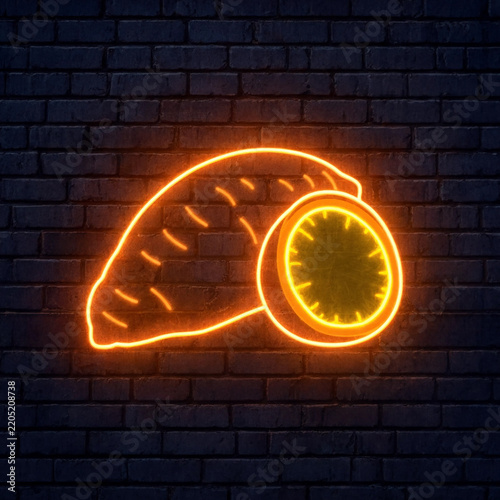 Bright orange neon sign shaped like a sweet potato on a dark brick wall