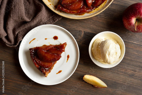 Delicious apple tarte Tatin with sweet caramelized red apples and sugar caramel served with ice cream