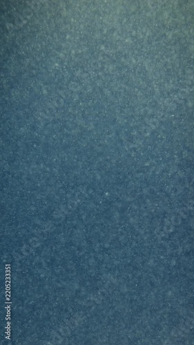 Abstract underwater background. Dirty water close up.