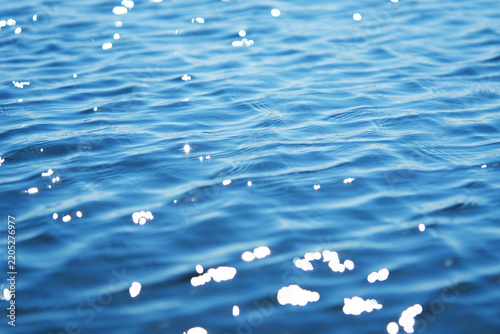 The glare of the water in the sea.