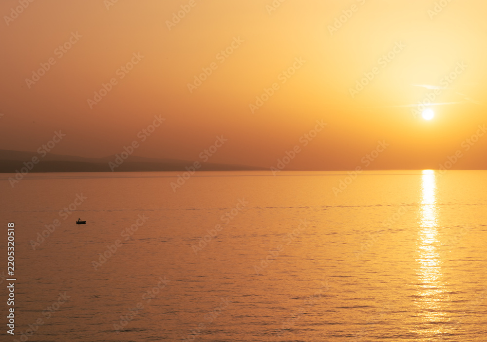 Obraz premium Landscape of mountains, sea, beautiful stone, pine trees and sunset, tree in the background
