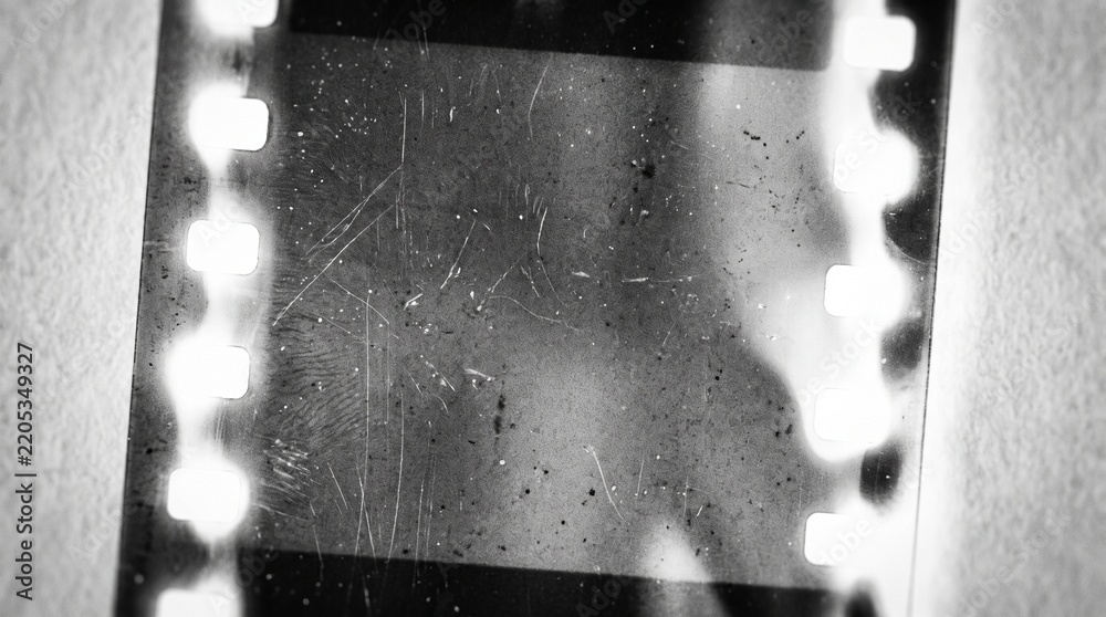 Fototapeta premium Old film texture with scratches, noise and light leaks. Realistic transparent overlay film texture in black-white, dust and grain. Distressed retro movie or photo negative effect of cinema nostalgia