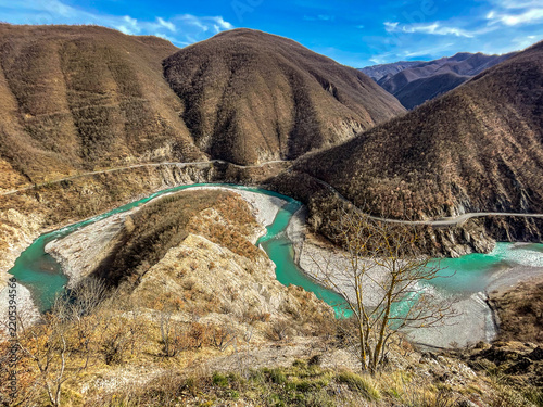 Meander of the Trebbia river with turquoise waters in Val Trebbia, Italy