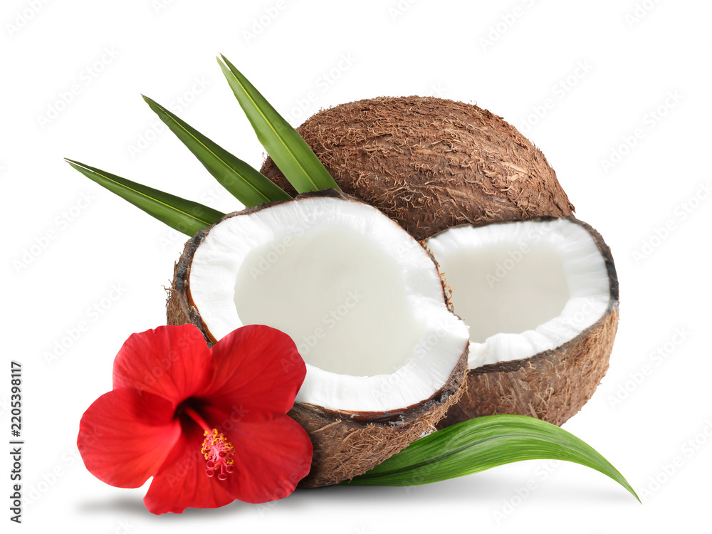 Fototapeta premium Fresh coconuts, hibiscus flower and green leaves isolated on white