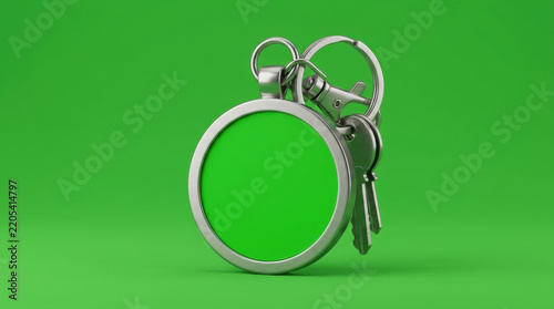 Metallic keychain tag featuring round green center plate and keyring attached with metal keys against vibrant solid backdrop.