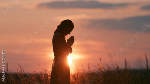 Humble Moment of Prayer: Female Silhouette in Serene Outdoor Scenery