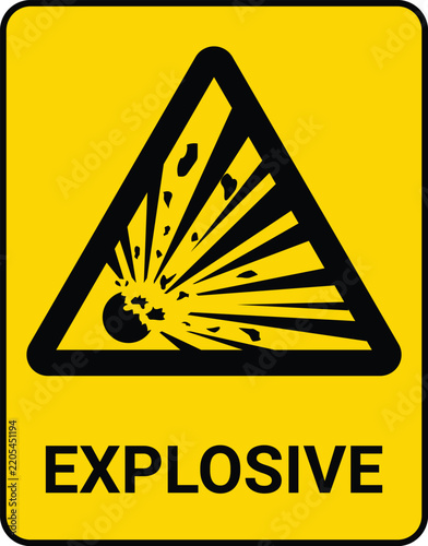 Explosive hazard warning sign. Vertical yellow rectangle safety label with a black border, featuring an exploding bomb icon in a triangle and bold text.
