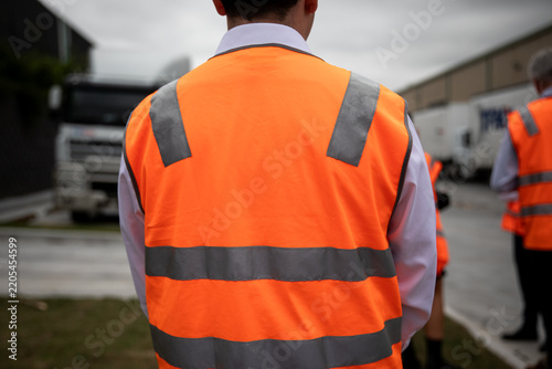 Warehouse Workers Wearing Reflective Safety Vests Outdoors