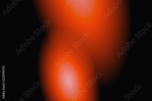 Abstract red and orange light gradients on a dark black background. Soft glowing blurry illumination. Moody modern wallpaper design for creative art projects and digital display