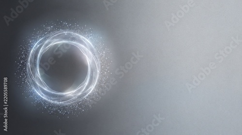 Abstract glowing plasma ring composed of swirling white light trails and shimmering blue particles against a textured gray gradient background with ample copy space for design.