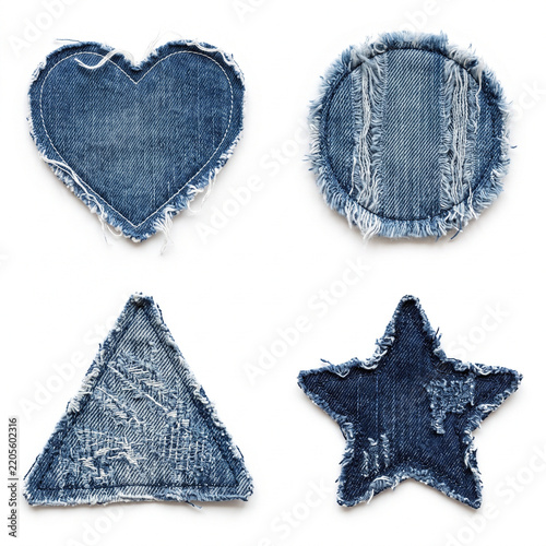 Collection of distressed denim fabric patches in various geometric and symbolic shapes including a heart triangle circle and star representing craft creativity sewing and DIY projects with a