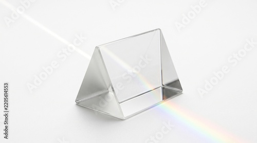 Glass triangular prism refracting white light into a rainbow spectrum