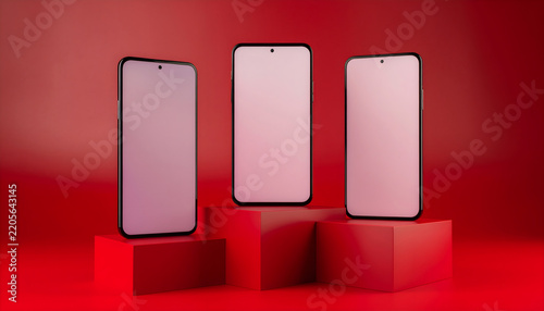 Three modern smartphones mockup on red gradient platform display
