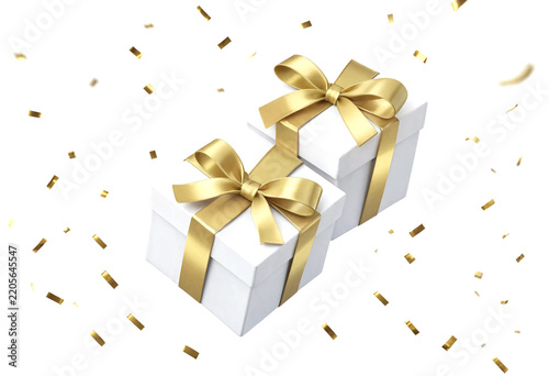 Two white gift boxes with golden ribbon and bows celebration confetti